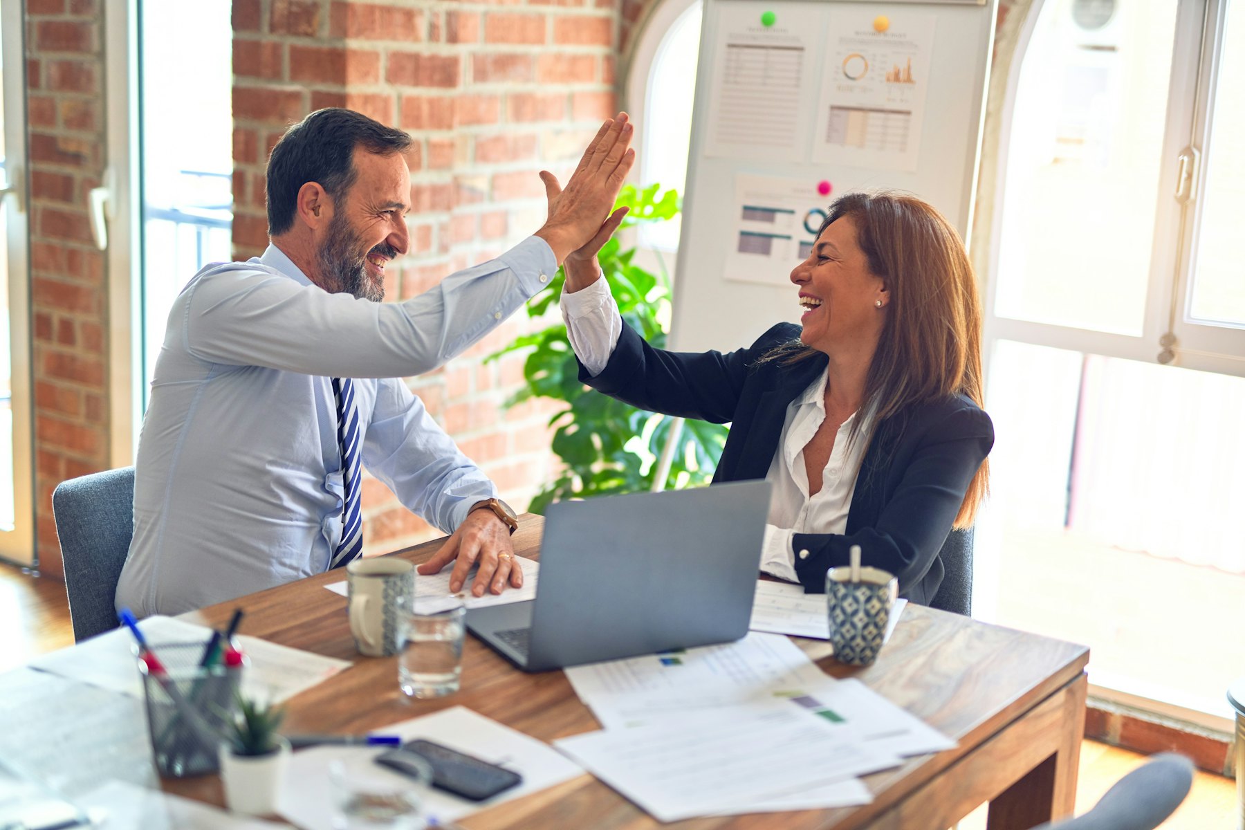 Consultants reviewing documents with a client